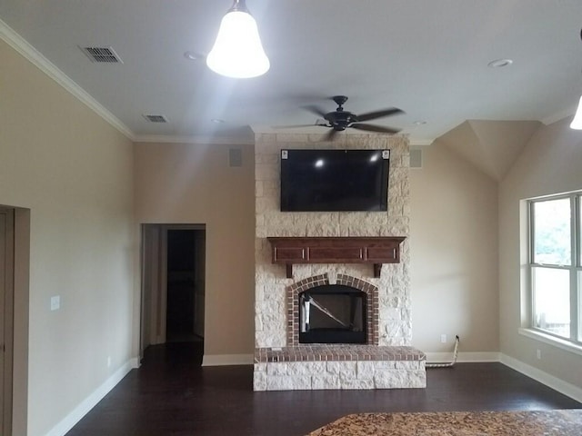 unfurnished living room featuring visible vents, dark wood finished floors, a fireplace, and crown molding