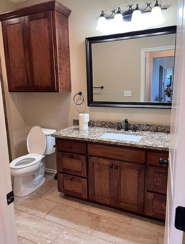 bathroom with toilet and vanity