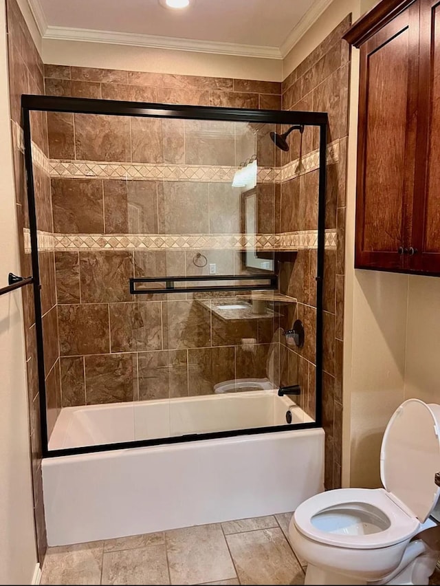 bathroom featuring bath / shower combo with glass door, toilet, and ornamental molding