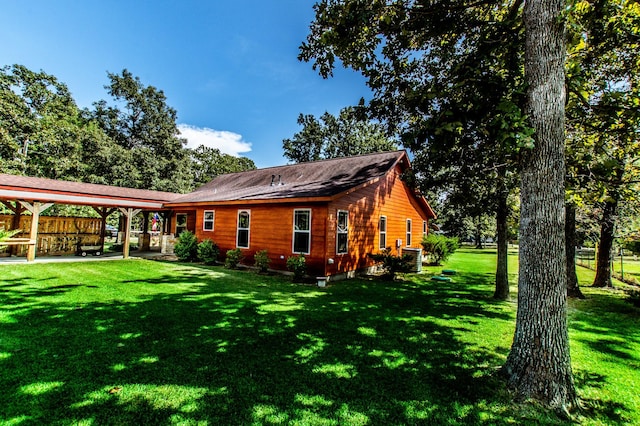 rear view of property featuring a patio area, cooling unit, a gazebo, and a yard