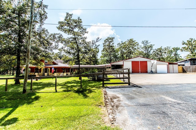 exterior space with an outdoor structure, fence, and a garage