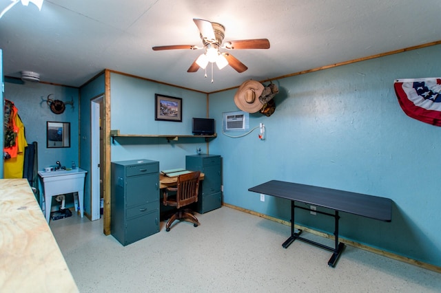 office featuring a wall mounted air conditioner, ornamental molding, and ceiling fan