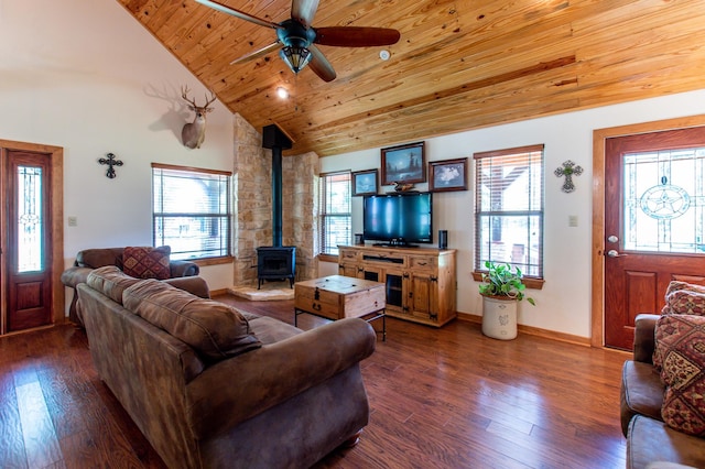 living room with dark wood finished floors, wooden ceiling, high vaulted ceiling, and a wood stove