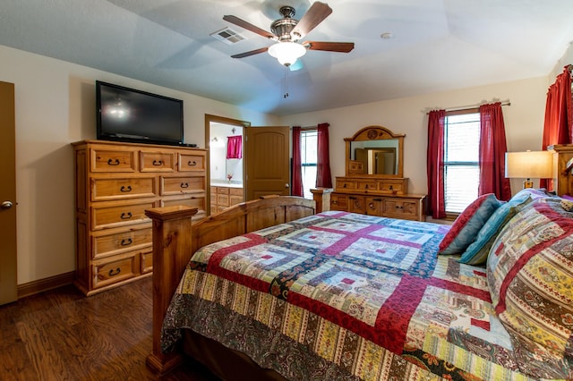 bedroom featuring visible vents, multiple windows, baseboards, and dark wood-style flooring