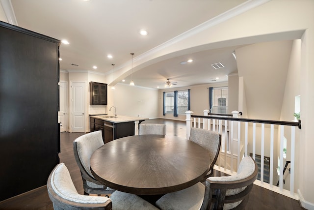 dining area featuring visible vents, recessed lighting, crown molding, and dark wood-type flooring