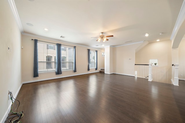 unfurnished room with visible vents, crown molding, ceiling fan, dark wood-type flooring, and baseboards