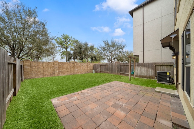 view of patio with cooling unit and a fenced backyard