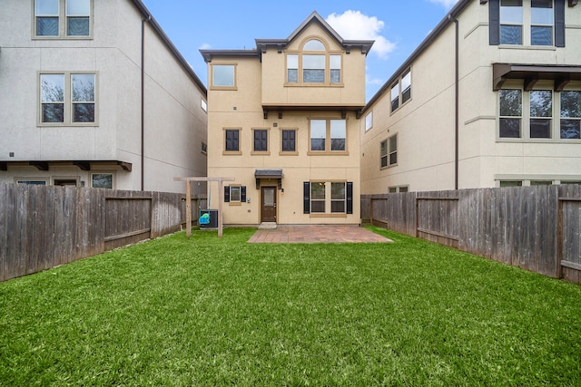 back of property featuring a patio, cooling unit, a fenced backyard, stucco siding, and a lawn