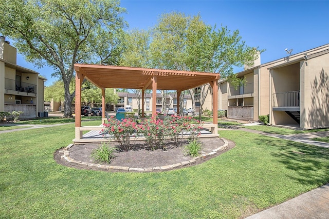 view of home's community with a yard