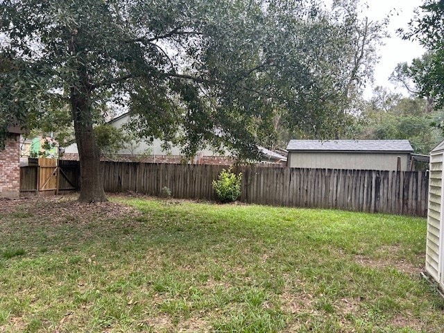 view of yard with a fenced backyard