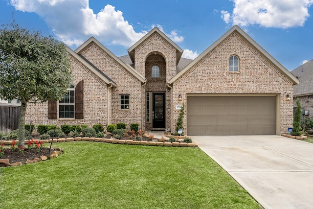 view of front of home featuring brick siding, concrete driveway, a garage, and a front yard