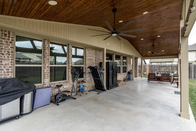 view of patio / terrace with a ceiling fan and fence