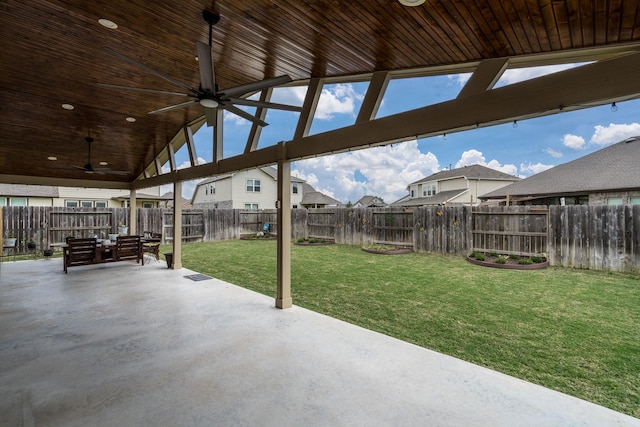 view of patio with a fenced backyard, a residential view, and ceiling fan