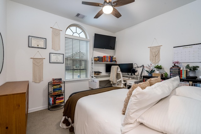 bedroom with visible vents, baseboards, a ceiling fan, and carpet flooring