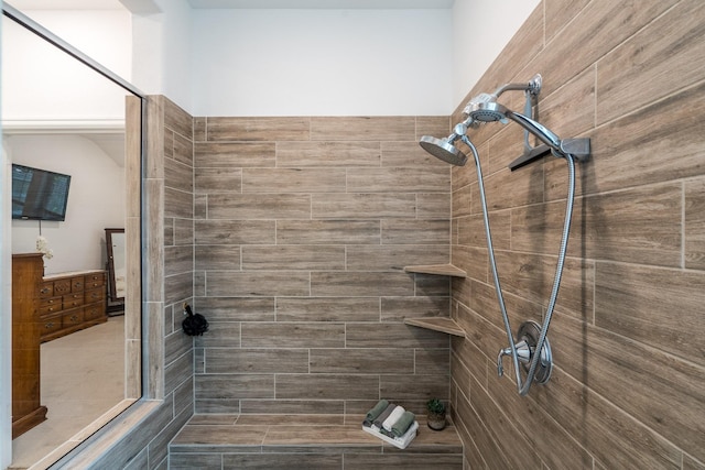 bathroom with a tile shower