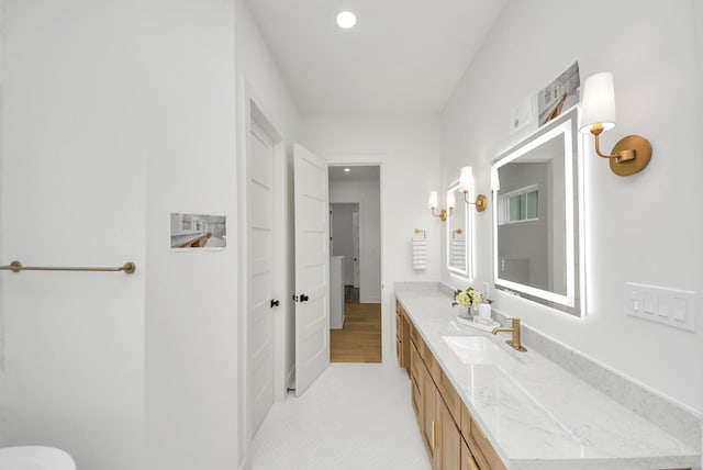 bathroom featuring vanity and recessed lighting