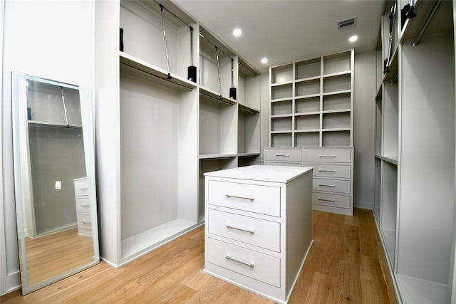 walk in closet featuring visible vents and light wood finished floors