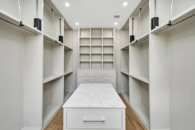 walk in closet with visible vents and light wood-style floors