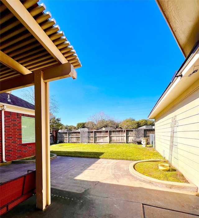 view of patio featuring fence