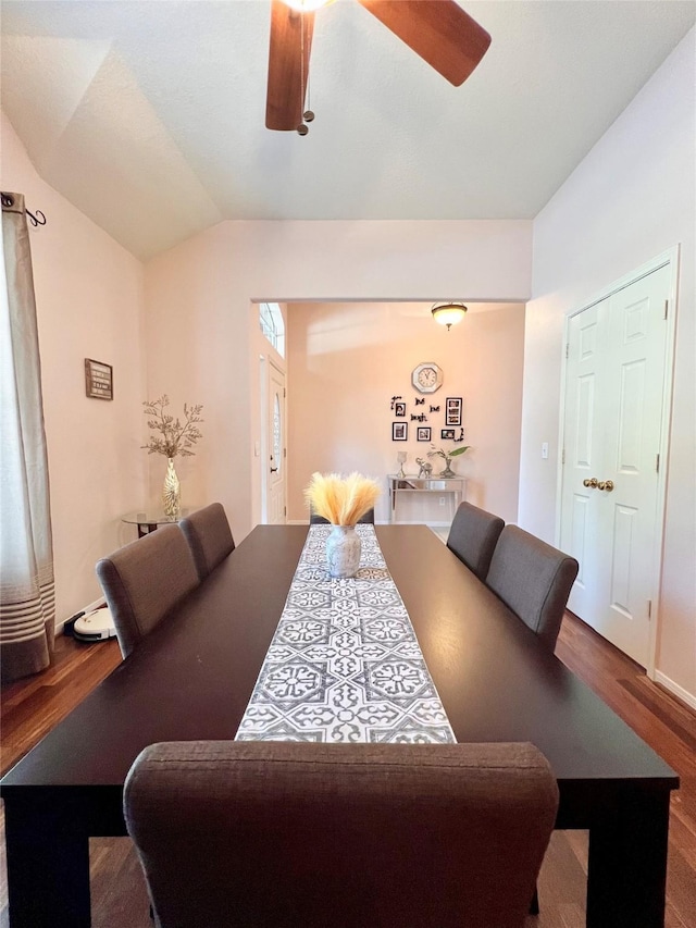 dining space featuring vaulted ceiling, ceiling fan, and wood finished floors