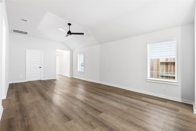 spare room featuring lofted ceiling, a ceiling fan, visible vents, and a wealth of natural light