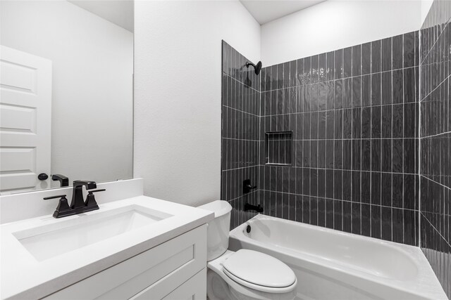 bathroom with vanity, toilet, and  shower combination