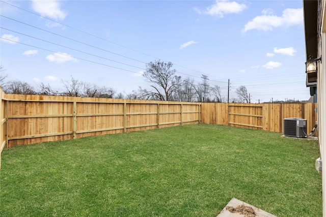 view of yard with cooling unit and a fenced backyard