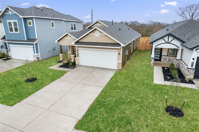 view of front facade featuring concrete driveway, a front yard, a garage, and a shingled roof