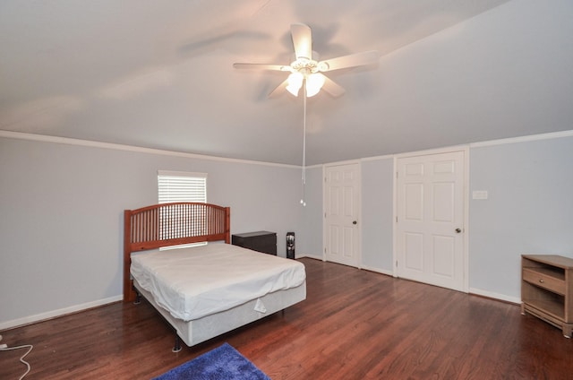 unfurnished bedroom featuring ceiling fan, baseboards, lofted ceiling, and wood finished floors