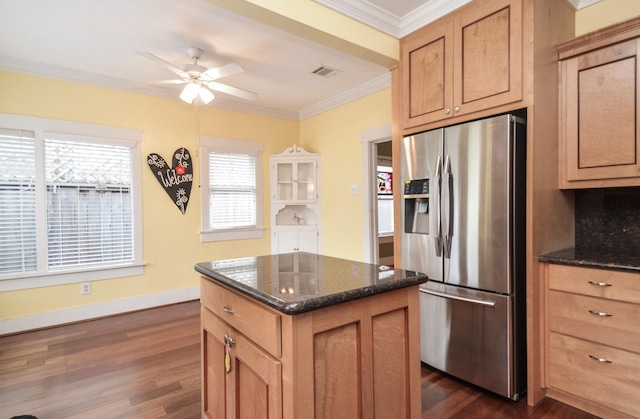 kitchen featuring visible vents, ornamental molding, stainless steel refrigerator with ice dispenser, dark wood finished floors, and ceiling fan