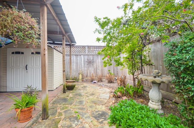 view of patio featuring an outbuilding and a fenced backyard