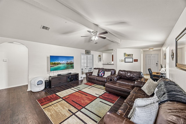 living area featuring visible vents, lofted ceiling with beams, wood finished floors, arched walkways, and ceiling fan