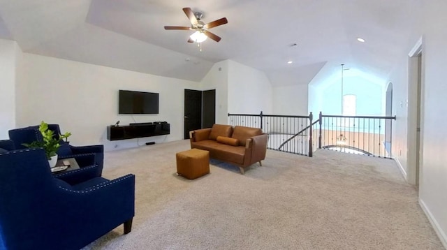 living area with carpet floors, lofted ceiling, and a ceiling fan