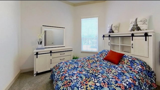 carpeted bedroom with baseboards