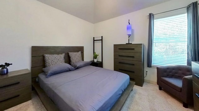 bedroom with light colored carpet