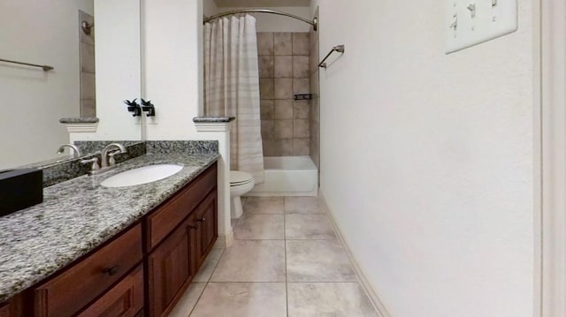 full bath with vanity, shower / bathtub combination with curtain, baseboards, tile patterned floors, and toilet