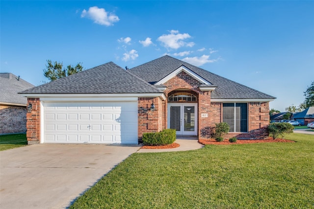 ranch-style home featuring french doors, brick siding, concrete driveway, and a front yard