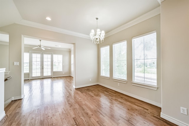 unfurnished dining area with a healthy amount of sunlight, wood finished floors, baseboards, and ornamental molding