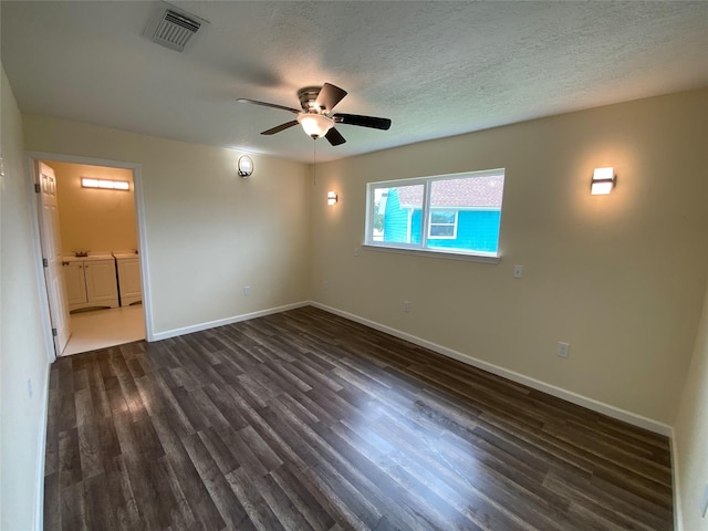 9 Flounder Cir, Freeport, TX 77541 - empty room with a ceiling fan, dark wood-style flooring, and a textured ceiling