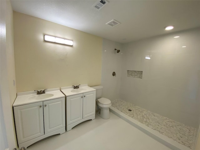 9 Flounder Cir, Freeport, TX 77541 - bathroom with a tile shower and double vanity