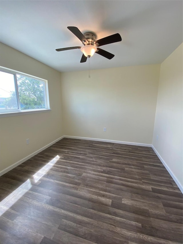 9 Flounder Cir, Freeport, TX 77541 - spare room featuring dark wood-style flooring and a ceiling fan