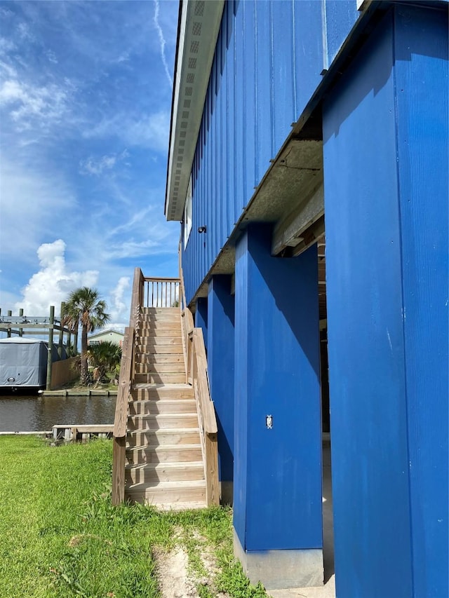 9 Flounder Cir, Freeport, TX 77541 - view of side of home with board and batten siding and stairs