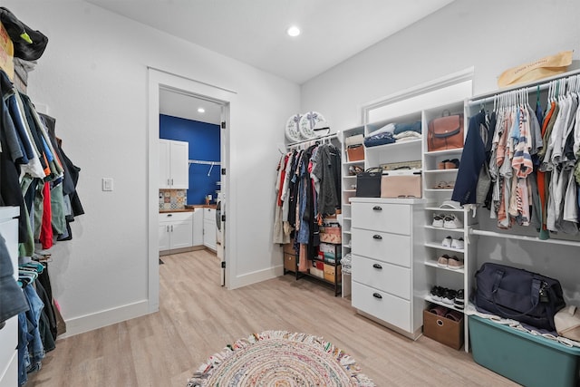 spacious closet featuring light wood-type flooring