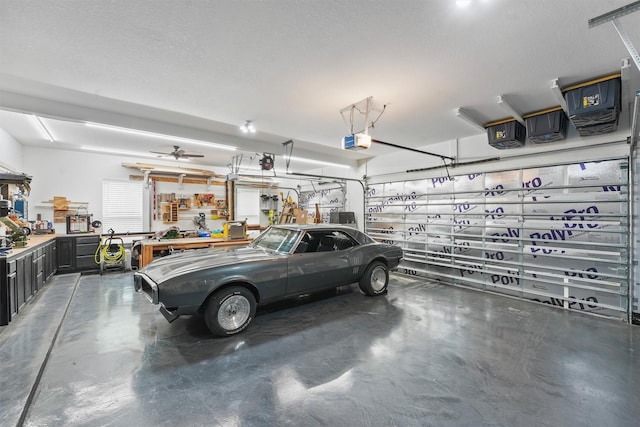 garage featuring a workshop area and a garage door opener