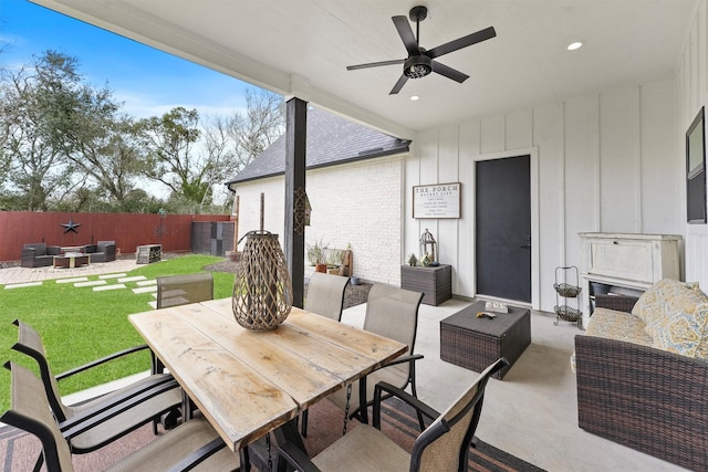 view of patio / terrace with an outdoor living space, outdoor dining area, a ceiling fan, and fence