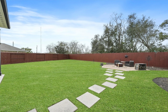 view of yard with a patio and a fenced backyard