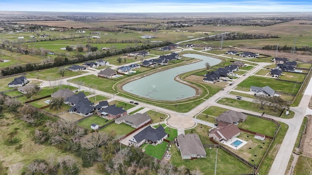 birds eye view of property with a residential view and a water view