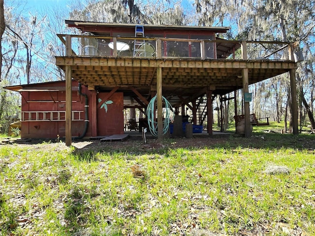 back of house with a wooden deck and stairs