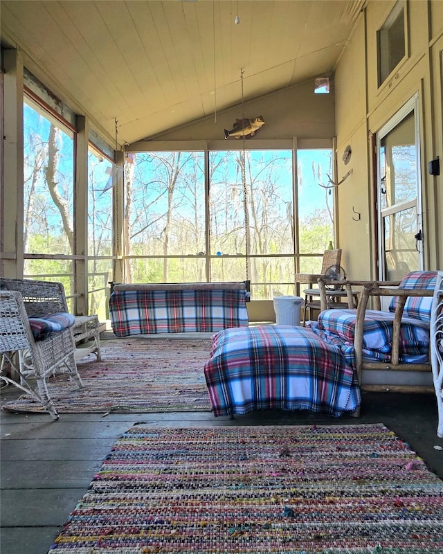 sunroom with wooden ceiling and lofted ceiling