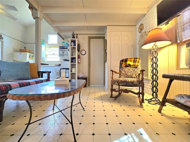 interior space featuring tile patterned floors and lofted ceiling with beams